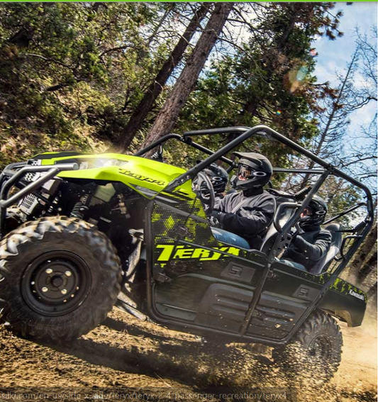 Two people in a yellow and black UTV driving through a forest.